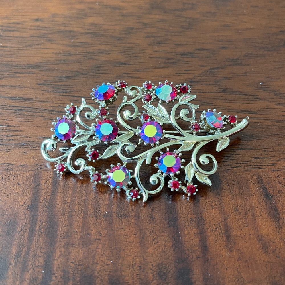 Pretty Leaf Pin with Red AB Rhinestones
silvertone purple crystal vintage